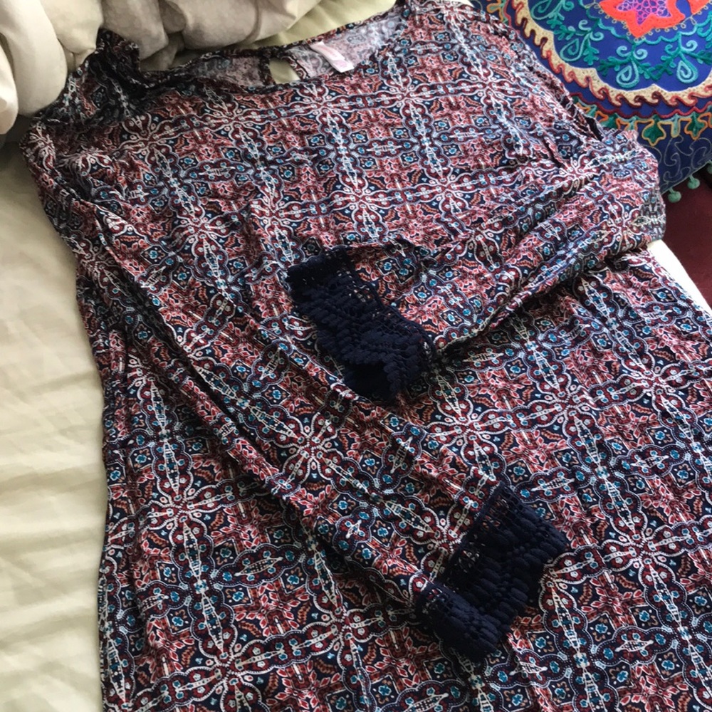Tunic or dress hits above knee, lace trim sleeves